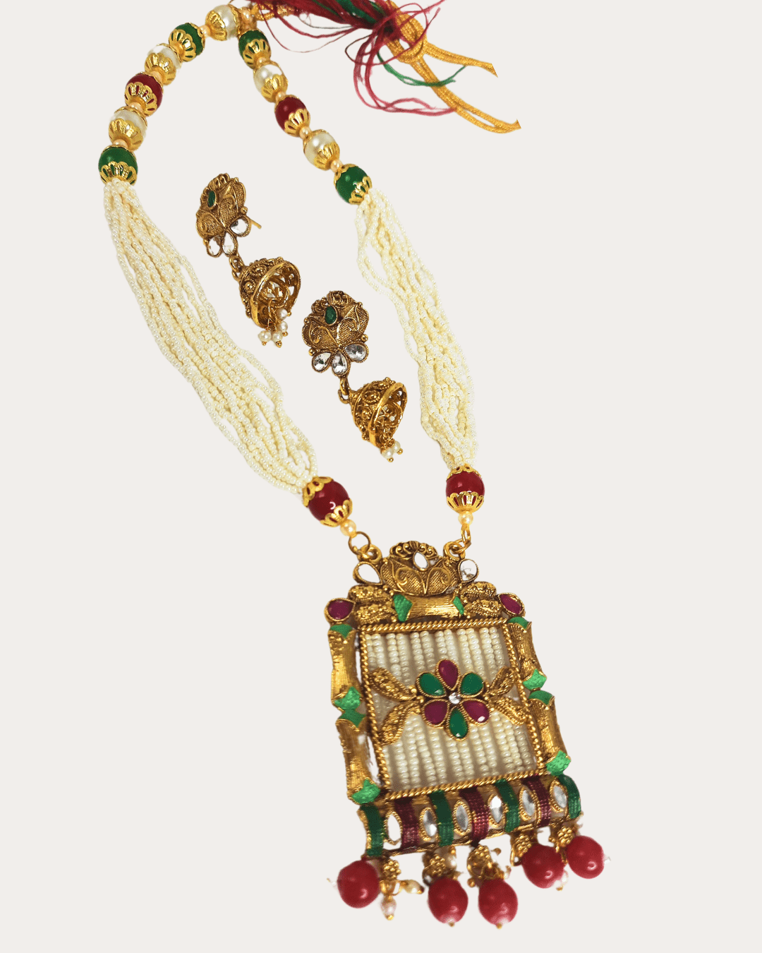 Kundan gold-plated pendant adorned with intricate moti necklace set with jhumka earring