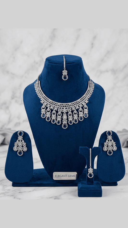 Dazzling Ad Stone Fitted Blue Colour Necklace Set With Maang Tikka